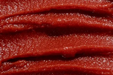 Macro Texture of Rich Tomato Paste. Culinary Red Background. Stock Photos