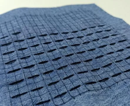 Macro texture of sashiko stitching on blue woven fabric Foto stock