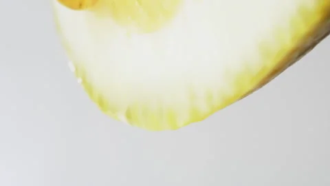 Macro Texture shot of Honey dripping down a fresh lemon slice, Flu remedy Stock Footage 132585084