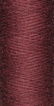 Macro texture of a skein of brown sewing thread Stock Photos