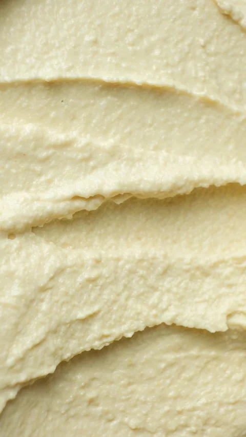 Macro texture of smooth creamy hummus top view Stock Footage 330328559