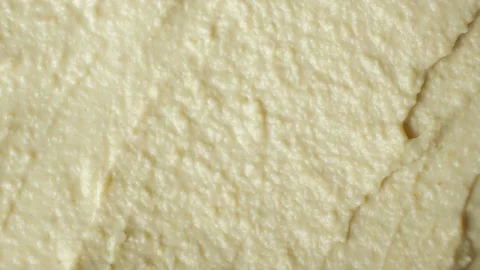 Macro texture of smooth creamy hummus top view Stock Footage 331731152