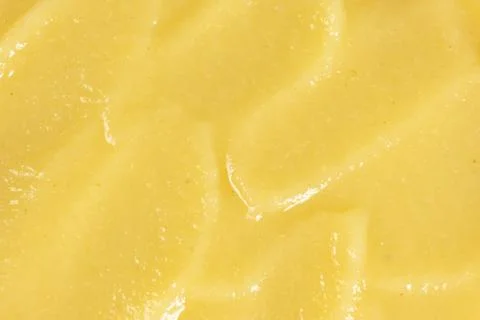 Macro texture of smooth organic apple puree top view. Stock Photos