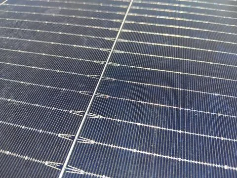 Macro texture of solar panel cells with detailed grid lines and blue crystall 스톡 사진