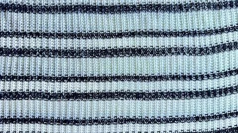 Macro texture of striped knitted fabric background with white and black yarn  Fotos de archivo