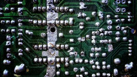 Macro texture of vintage printed circuit board PCB with solder joints Stock Photos