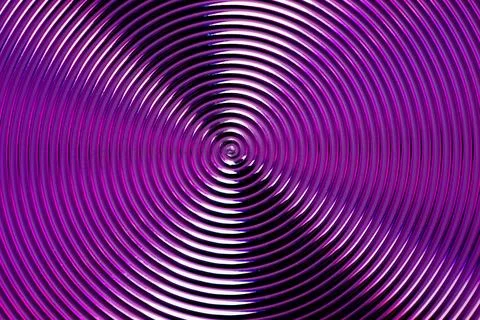 Macro texture of violet metallic spiral lines with shiny glossy reflections.. Stock Photos