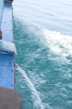 Macro Texture of Water Flowing off a Moving Tour Boat in the Ocean 库存照片