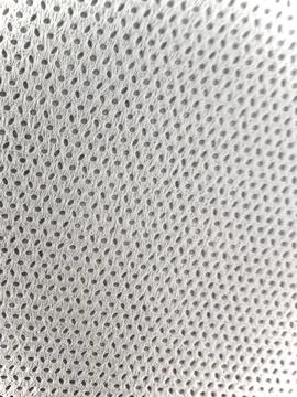 Macro Texture of White Non-Woven Synthetic Fabric with Perforated Pattern Stock Photos