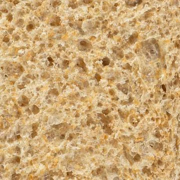 Macro texture of whole wheat bread crumb, detailed food background. Stock Photos