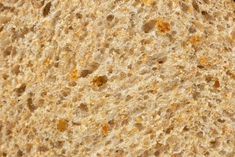 Macro texture of whole wheat bread crumb, detailed food background. Stock Photos