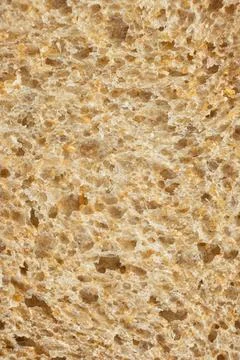 Macro texture of whole wheat bread crumb, detailed food background. Stock Photos