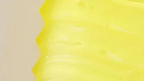 Macro texture of yellow cosmetics product, top view Stock Footage 310539955
