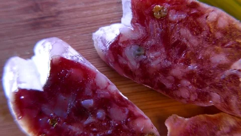 Macro of thin slices of salami on the dish. 4K UHD Stock Footage 73048266