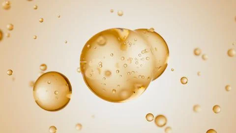Macro of three drops of beige liquid merge into one with bubbles inside. Skin Illustrazione stock