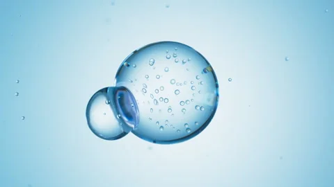 Macro of three drops of blue liquid merge into one with bubbles inside. Skin Stock Footage 276550017
