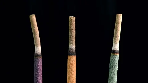 Macro of three incense sticks burning Stock-Footage 49083124