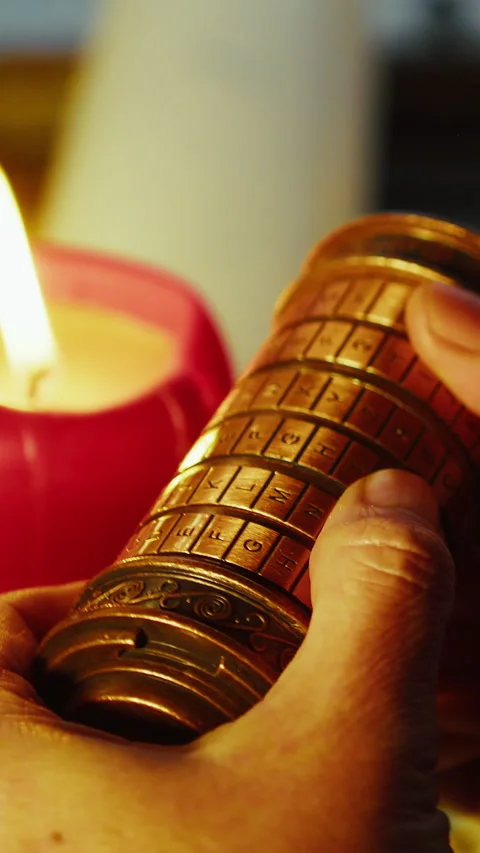 Macro Thumbs Turning Cryptex Code, Intense Puzzle Solving in Candlelight Stock Footage 334084400