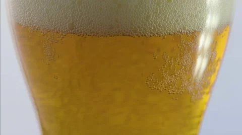 Macro tilt up on beer with head Video stock 68003069