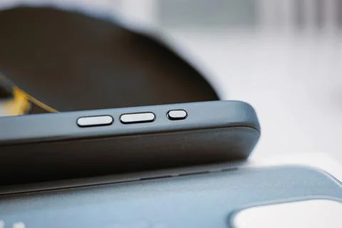 Macro Tilt-Shift of iPhone 15 Pro Max Action Button on Case Stock Photos