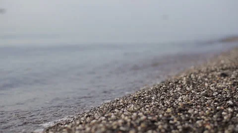 Macro tilt-shift pebble sea swash Stock Footage 53545299