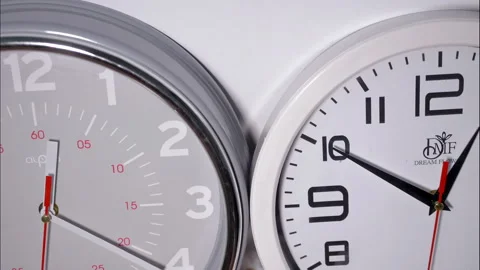 Macro Time-Lapse of Two Clocks Side-by-Side with Red Second Hands Stock Footage 337810112