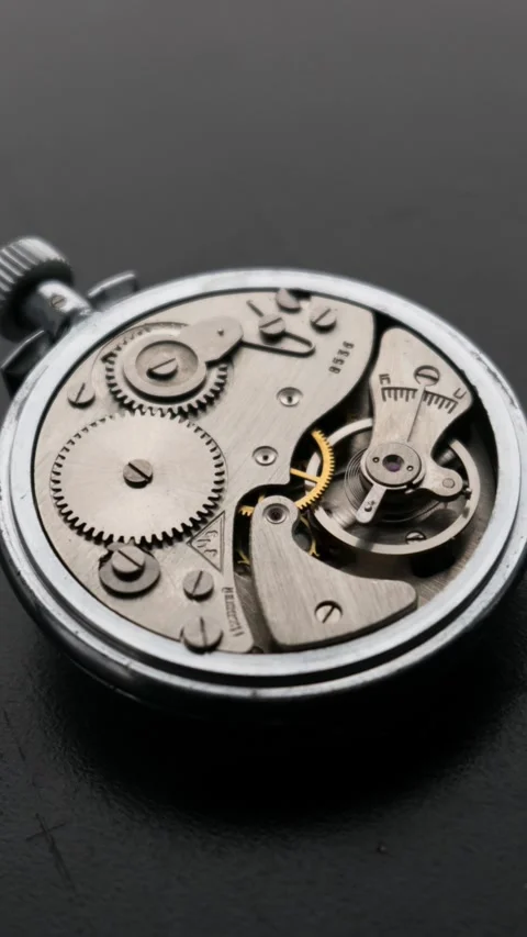 Macro time lapse of vintage mechanical pocket watch gears rotating Stock Footage 329132460