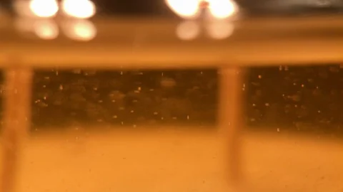 Macro Tiny Wax floating in candle oil Stock Footage 100614082