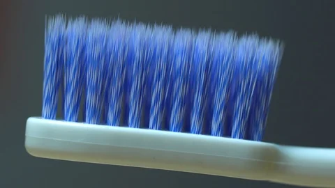 Macro Toothbrush bristles dramatic light pass shadow Stock Footage 119079257