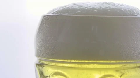 Macro top of beer glass pour perfect head Stock Footage