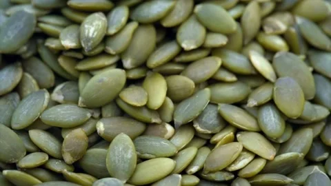 Macro top down shot of organic green pumpkin seeds Stock-Footage 334572825