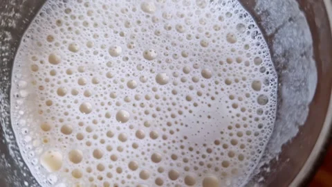 Macro Top-Down View of Foamy Bubbles in Beverage Stock Footage 321645772