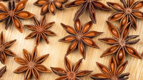 Macro Top View Of Dried Star Anise Spices Rotating On Wooden Board Видео 331450320