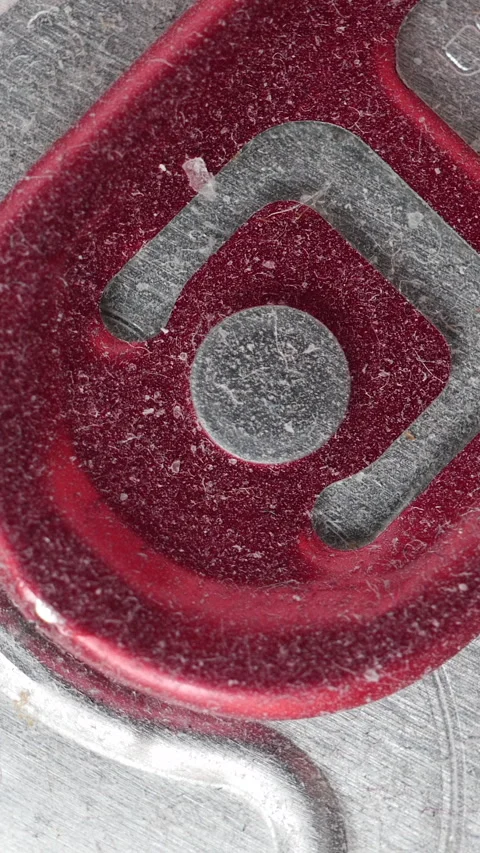 Macro Top View Of A Dusty Red Aluminum Drink Can Pull Tab Slowly Rotating. Bever Stock Footage 314674214