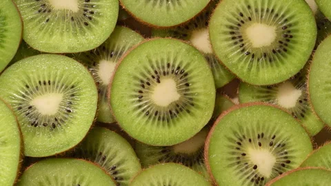 Macro top view of kiwi slices forming vibrant natural pattern. Stock Footage 330470953