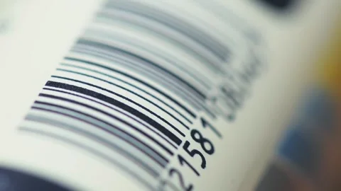 Macro tracking shot of barcode scanning concept on packaging Stock Footage 345812067