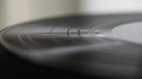Macro tracking shot of vinyl record spinning Stock Footage 46492467