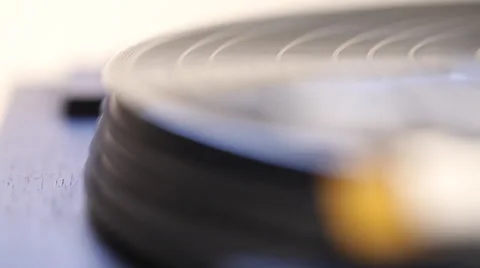 Macro tracking shot of vinyl record spinning Video stock 46493112