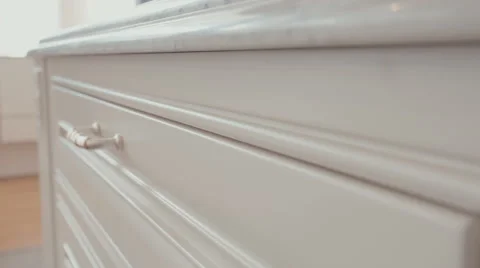 Macro tracking shot of a white luxury kitchen drawer Stock Footage 63499563