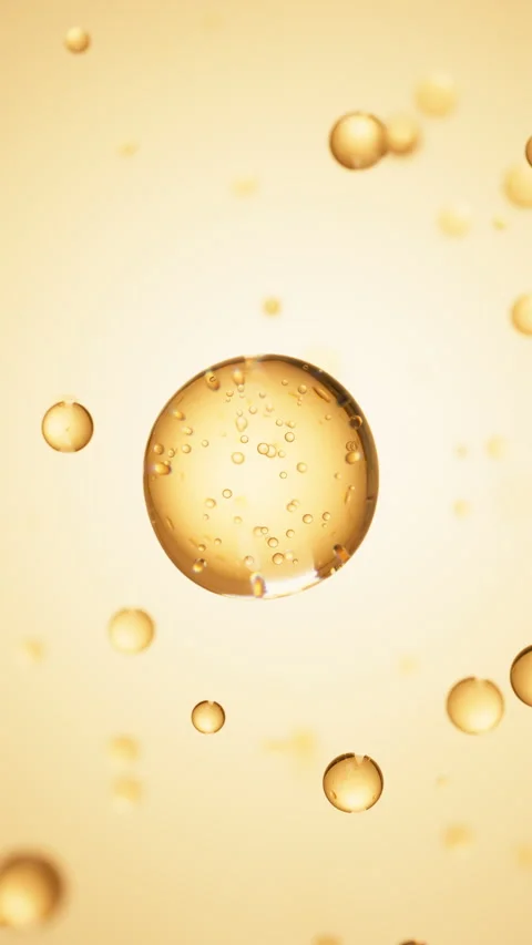Macro of transparent drop of beige liquid with bubbles inside on beige backdrop Stock Footage 323122767