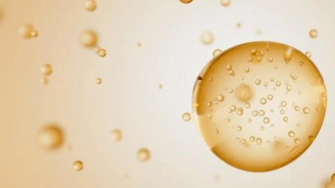 Macro of transparent drop of beige liquid with bubbles inside on beige backdrop Ilustração Stock