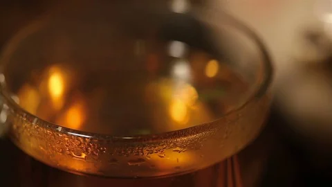 Macro of transparent teacup with hot herbal tea. Vídeos de archivo 72202866