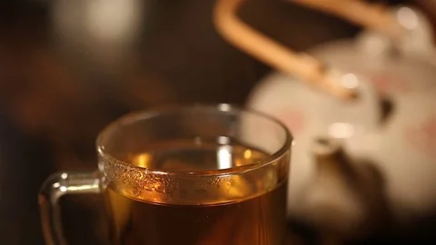 Macro of transparent teacup with hot herbal tea. Video stock 72202875