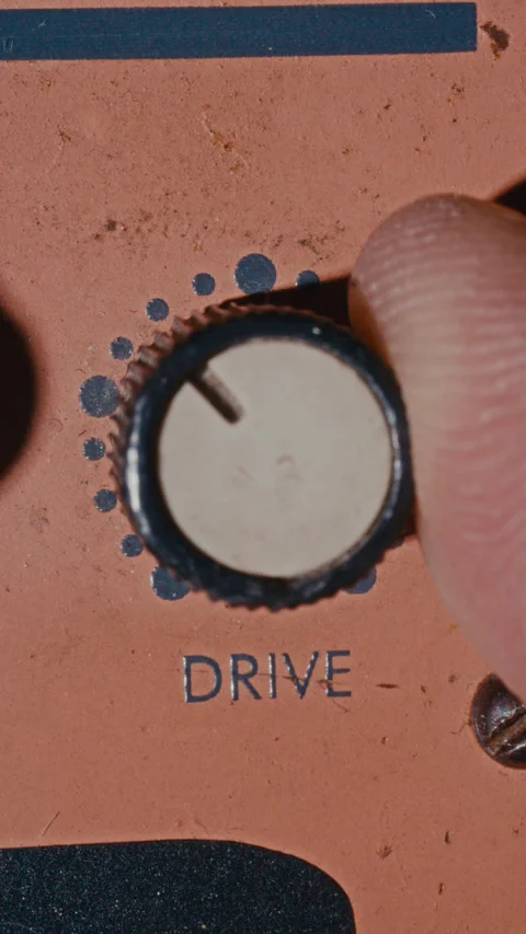Macro of Turning Drive Control Knob on Retro-Style Amplifier Panel Stock-Footage 342454442