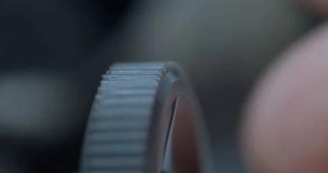 Macro turning a focus wheel on a microscope white male Stock Footage 110685042