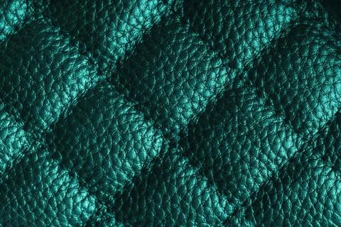 Macro of turquoise quilted leather texture background with stitched pattern.. Stock Photos