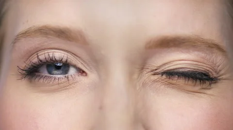 Macro of two beautiful eyes one is blinking Stock Footage 62281808