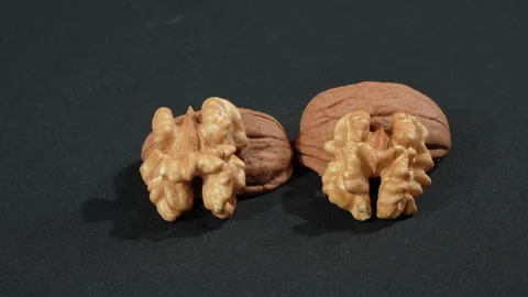 Macro Two Walnut Kernels Resting On Shells Black Background Stockbeeldmateriaal 332524307