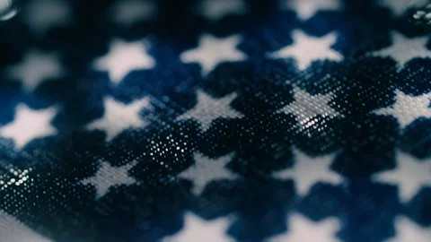 A Macro Ultra Closeup stylized pan over backlit American Flag &amp; fabric Stock Footage 91875922