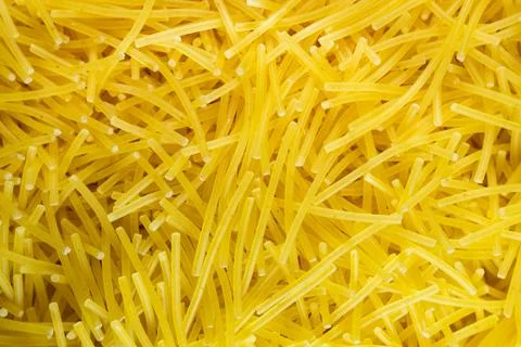 Macro Uncooked dry vermicelli pasta background full frame texture top view close Stock-Fotos